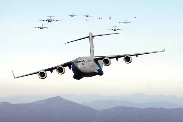 By Air: A Formation Of 17 C-17 Globemaster IIIs Fly Over The Blue Ridge Mountains by Stocktrek Images