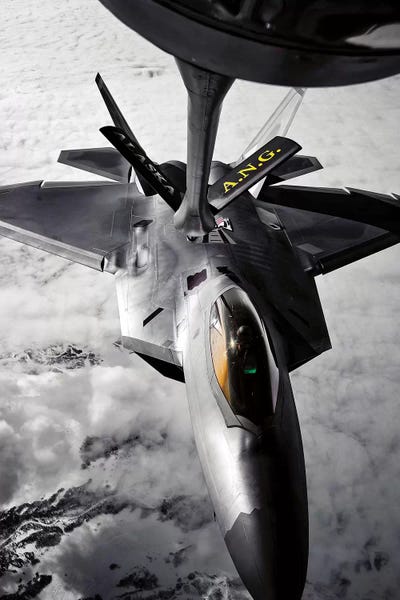 Airplanes: A KC-135 Stratotanker Refuels A F-22 Raptor by Stocktrek Images