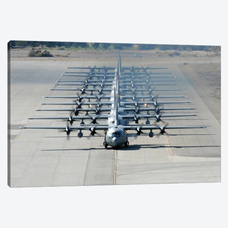A Line Of C-130 Hercules Taxi At Nellis Air Force Base, Nevada Canvas Print #TRK562} by Stocktrek Images Canvas Wall Art