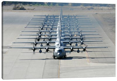 A Line Of C-130 Hercules Taxi At Nellis Air Force Base, Nevada Canvas Art Print - Air Force