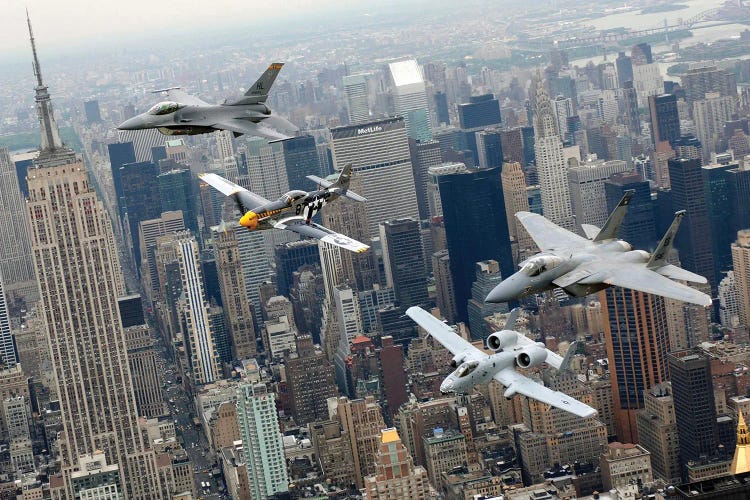 A P-51 Mustang, F-16 Fighting Falcon, F-15 Eagle, And A-10 Thunderbolt II Fly Over New York City