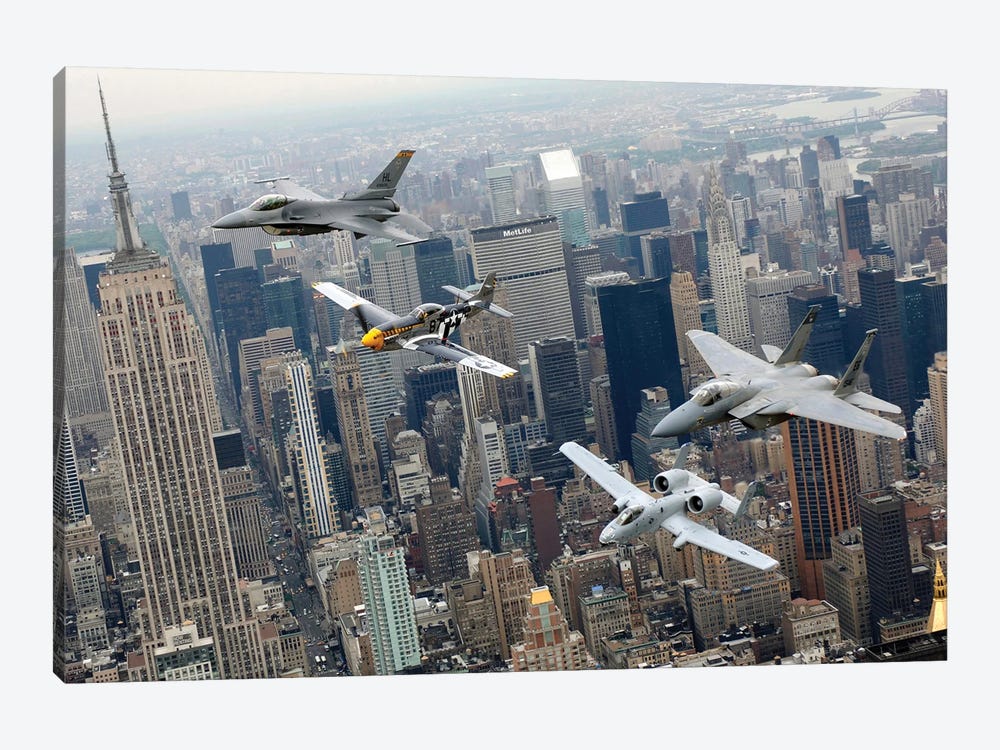 A P-51 Mustang, F-16 Fighting Falcon, F-15 Eagle, And A-10 Thunderbolt II Fly Over New York City by Stocktrek Images 1-piece Canvas Print