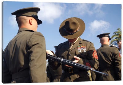 A Senior Drill Instructor Inspects A Recruit's Rifle For Cleanliness Canvas Art Print