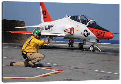A Shooter Signals The Launch Of A T-45A Goshawk Trainer Aircraft Canvas Art Print - Aircraft Carriers