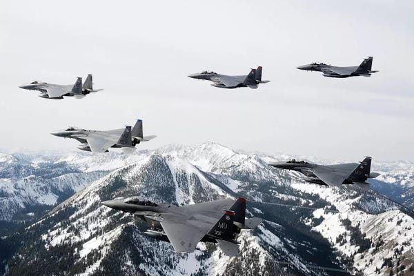 Rocky Mountains: A Six-Ship Formation Of Aircraft Fly Over The Sawtooth Mountains In Idaho by Stocktrek Images