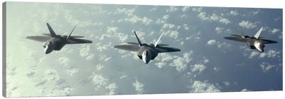 A Three-Ship Formation Of F-22 Raptors Fly Over The Pacific Ocean Canvas Art Print - Military Aircraft Art