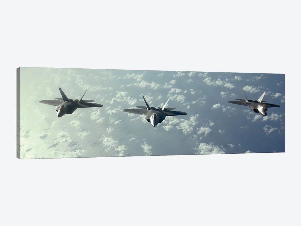 A Three-Ship Formation Of F-22 Raptors Fly Over The Pacific Ocean by Stocktrek Images 1-piece Canvas Art
