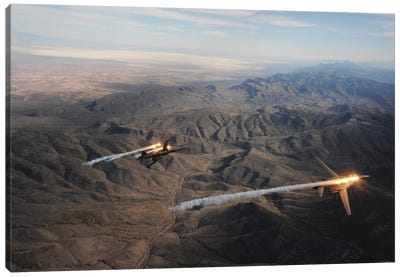 A Two-Ship Of B-1B Lancers Release Chaff And Flares While Maneuvering Over New Mexico Canvas Art Print - Military Aircraft Art