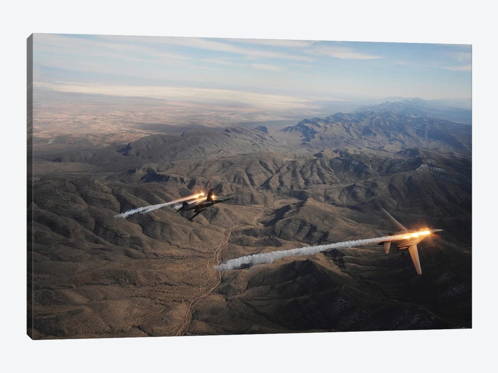 A Two-Ship Of B-1B Lancers Release Chaff And Flares While Maneuvering Over New Mexico by Stocktrek Images 1-piece Canvas Wall Art