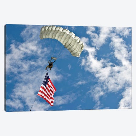 A US Air Force Member Glides Through The Sky With The American Flag Canvas Print #TRK624} by Stocktrek Images Canvas Art