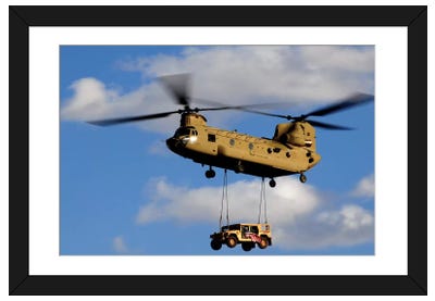 A US Army CH-47 Chinook Helicopter Transports A Humvee Paper Art Print - Best Selling Paper