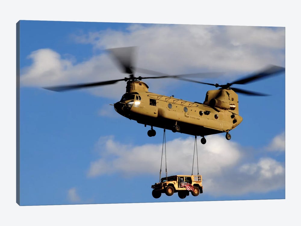 A US Army CH-47 Chinook Helicopter Transports A Humvee by Stocktrek Images 1-piece Art Print