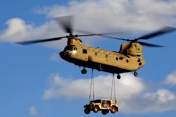 Large Photography - Canvas Prints: A US Army CH-47 Chinook Helicopter Transports A Humvee by Stocktrek Images