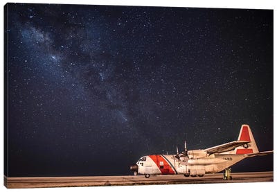 A US Coast Guard C-130 Hercules Parked On The Tarmac On A Starry Night Canvas Art Print - Veterans Day