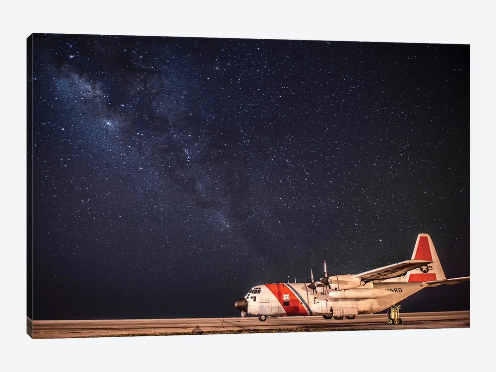 A US Coast Guard C-130 Hercules Parked On The Tarmac On A Starry Night by Stocktrek Images 1-piece Canvas Wall Art