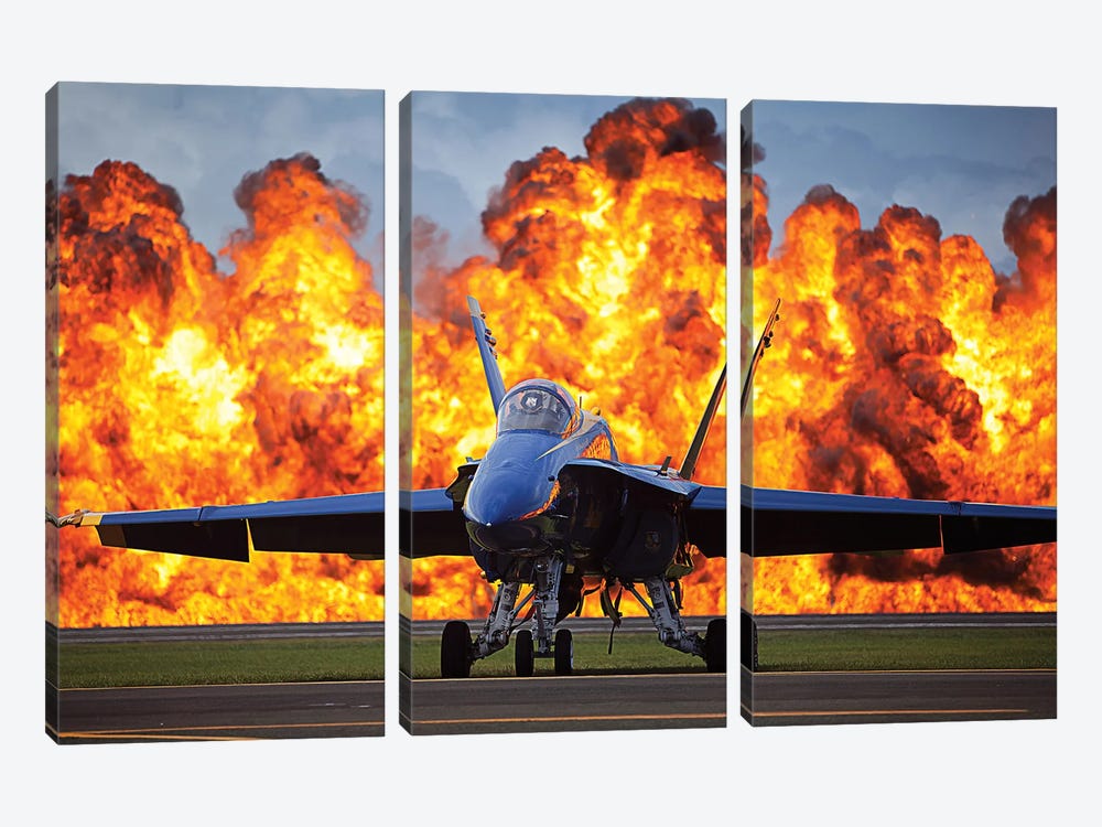 A Wall Of Fire Erupts Behind A US Navy F/A-18 Hornet Aircraft by Stocktrek Images 3-piece Canvas Art