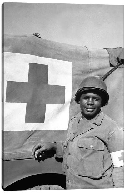 A WWII Soldier Stands Next To His Red Cross Vehicle Canvas Art Print - Soldier Art