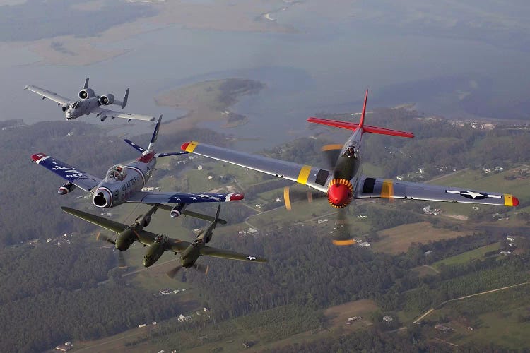 An A-10 Thunderbolt, F-86 Sabre, P-38 Lightning And P-51 Mustang In Flight