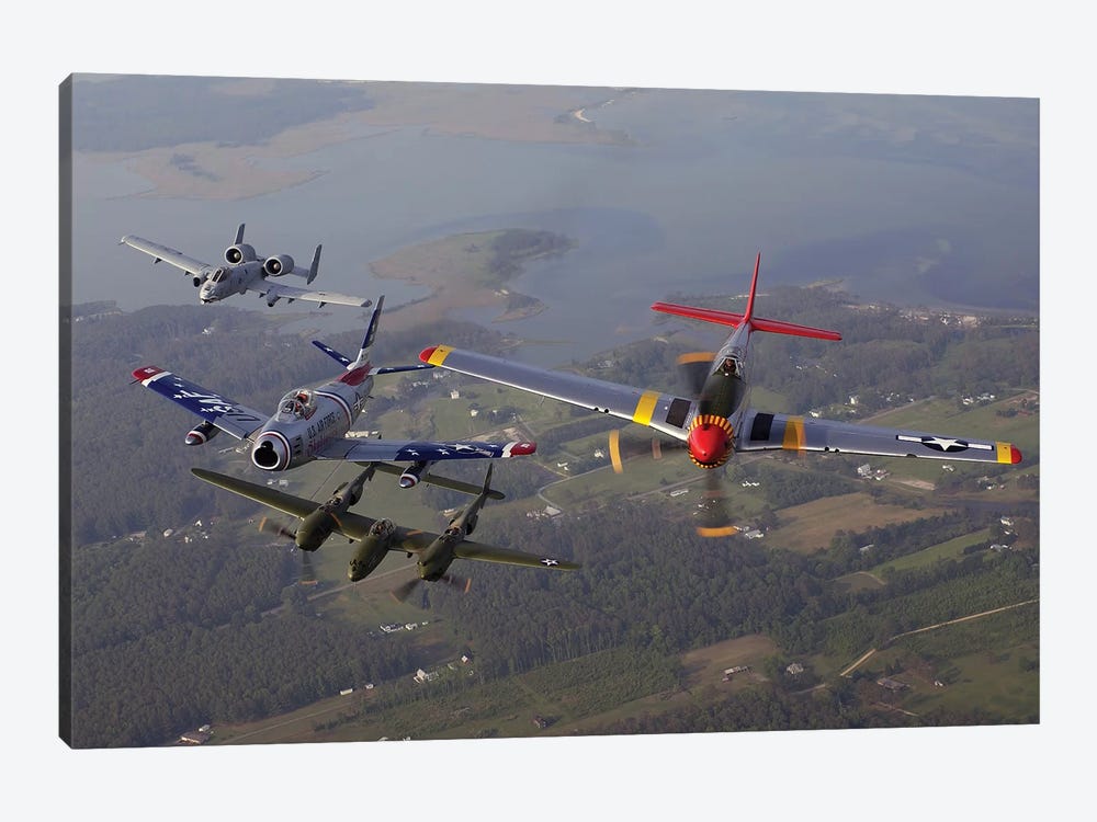 An A-10 Thunderbolt, F-86 Sabre, P-38 Lightning And P-51 Mustang In Flight by Stocktrek Images 1-piece Canvas Art Print