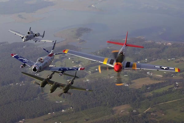 Stocktrek Images: An A-10 Thunderbolt, F-86 Sabre, P-38 Lightning And P-51 Mustang In Flight by Stocktrek Images