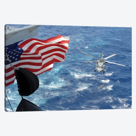 An MH-60S Sea Hawk Carries Supplies During A Replenishment At Sea Canvas Print #TRK751} by Stocktrek Images Canvas Print