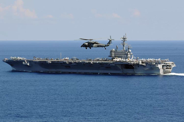 An MH-60S Seahawk Helicopter Flies Over USS George H.W. Bush