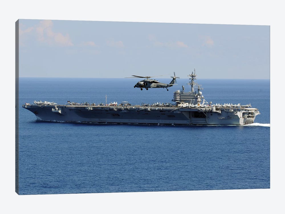 An MH-60S Seahawk Helicopter Flies Over USS George H.W. Bush by Stocktrek Images 1-piece Canvas Art