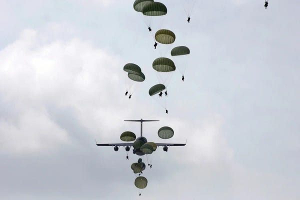 Military Aircraft: Army Soldiers Jump Out Of A C-17 Globemaster III by Stocktrek Images