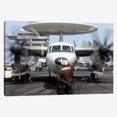 Aviation Electronics Technician Directs An E-2C Hawkeye To Start Its Engines Canvas Print #TRK768} by Stocktrek Images Canvas Artwork
