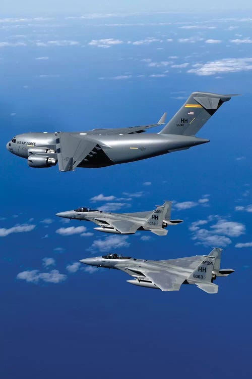 F-15B Eagles Escort The First Hawaii-Based C-17 Globemaster III To Its Home I by Stocktrek Images wall art