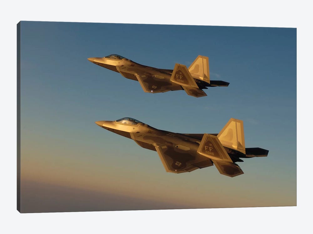 F-22A Raptors Fly Over Langley Air Force Base, Virginia by Stocktrek Images 1-piece Canvas Print