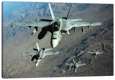 Four US Navy F/A-18 Hornet Aircraft Fly Over Mountains In Afghanistan Canvas Art Print - Navy