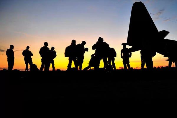 Military Aircraft: Green Berets Prepare To Board A KC-130 Aircraft by Stocktrek Images