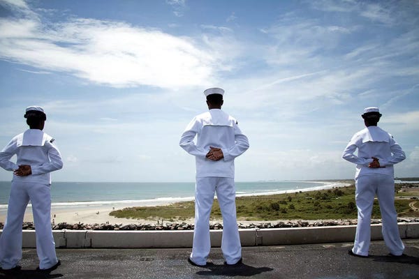 Navy: Sailors Man The Rails As The Ship Pulls Into Naval Station Norfolk by Stocktrek Images