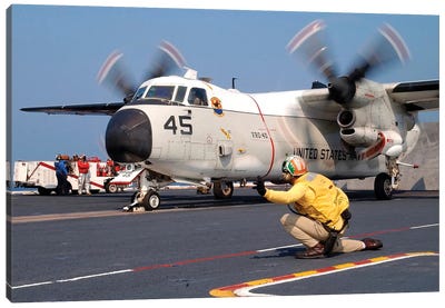 Signalman Gives The Launch Signal To A C-2A Greyhound Canvas Art Print - Aircraft Carrier Art