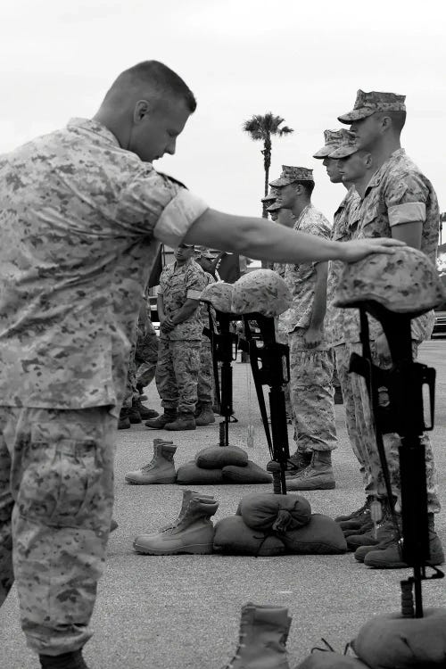 Soldier Pays His Respect To Fallen Marines