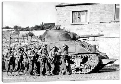 Soldiers And Their Tank Advance Into A Belgian Town During WWII Canvas Art Print - Military Vehicles