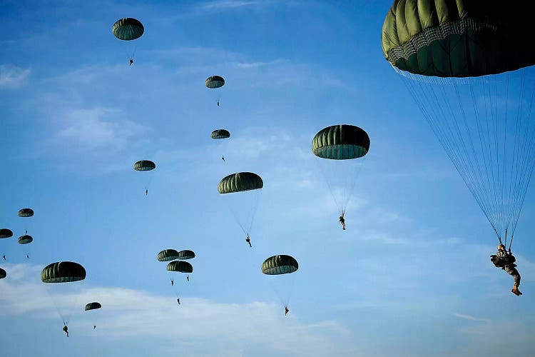 Soldiers Descend Under A Parachute Canopy During Operation Toy Drop