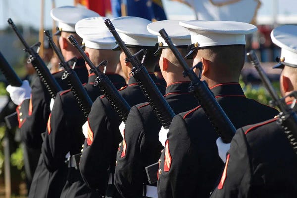Marines: The Marine Corp Base Kaneohe Rifle Team Performs The 21-Gun Salute by Stocktrek Images