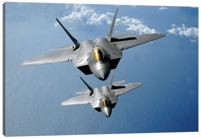 Two F-22 Raptors Fly Over The Pacific Ocean Canvas Art Print