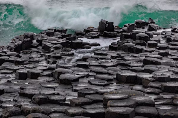 Giant's Causeway: Waves Crashing Into Basalt At The Giant'S Causeway In County Antrim, Northern, Ireland by Chuck Haney