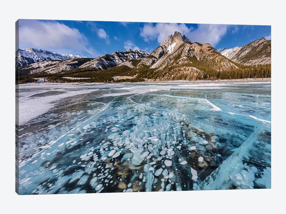 Mt. Abraham at sunrise and methane ice bubbles under clear ice on Abraham Lake, Alberta, Canada by Chuck Haney 1-piece Art Print