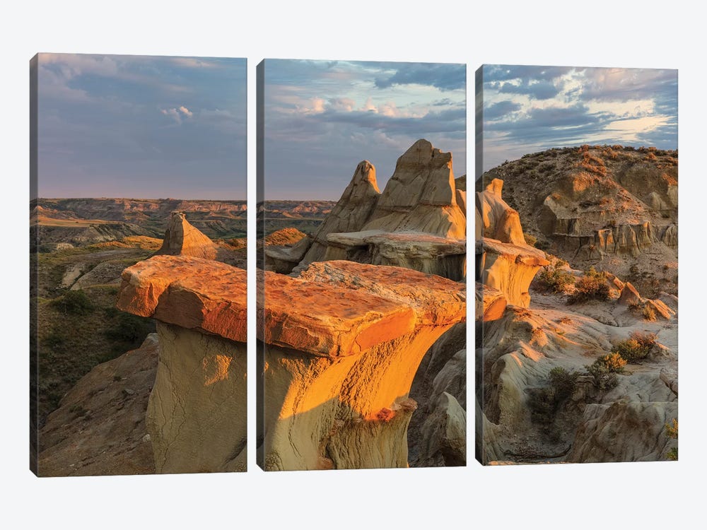 Sculpted badlands formations at first light in Theodore Roosevelt National Park, North Dakota, USA by Chuck Haney 3-piece Canvas Art Print