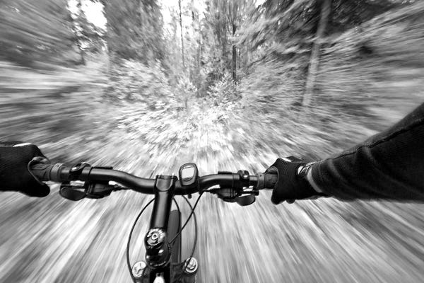 First Person Blurred Motion Mountain Biking View, West Glacier, Montana, USA