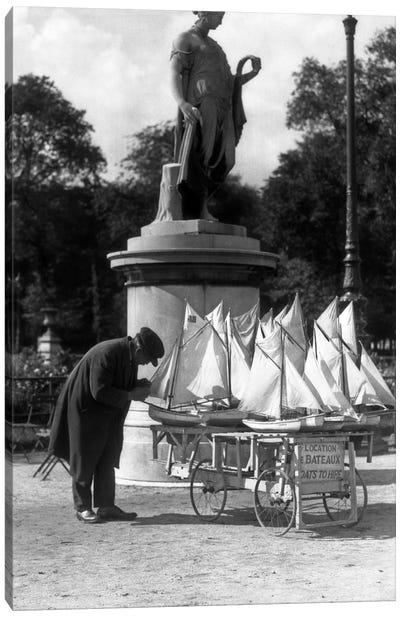 1930s Paris France Tuileries Gardens Man With Cart Of Miniature Toy Sailboats For Rent Canvas Art Print - Vintage Images