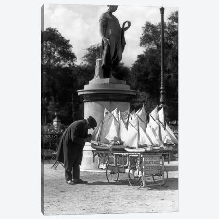 1930s Paris France Tuileries Gardens Man With Cart Of Miniature Toy Sailboats For Rent Canvas Print #VTG122} by Vintage Images Art Print