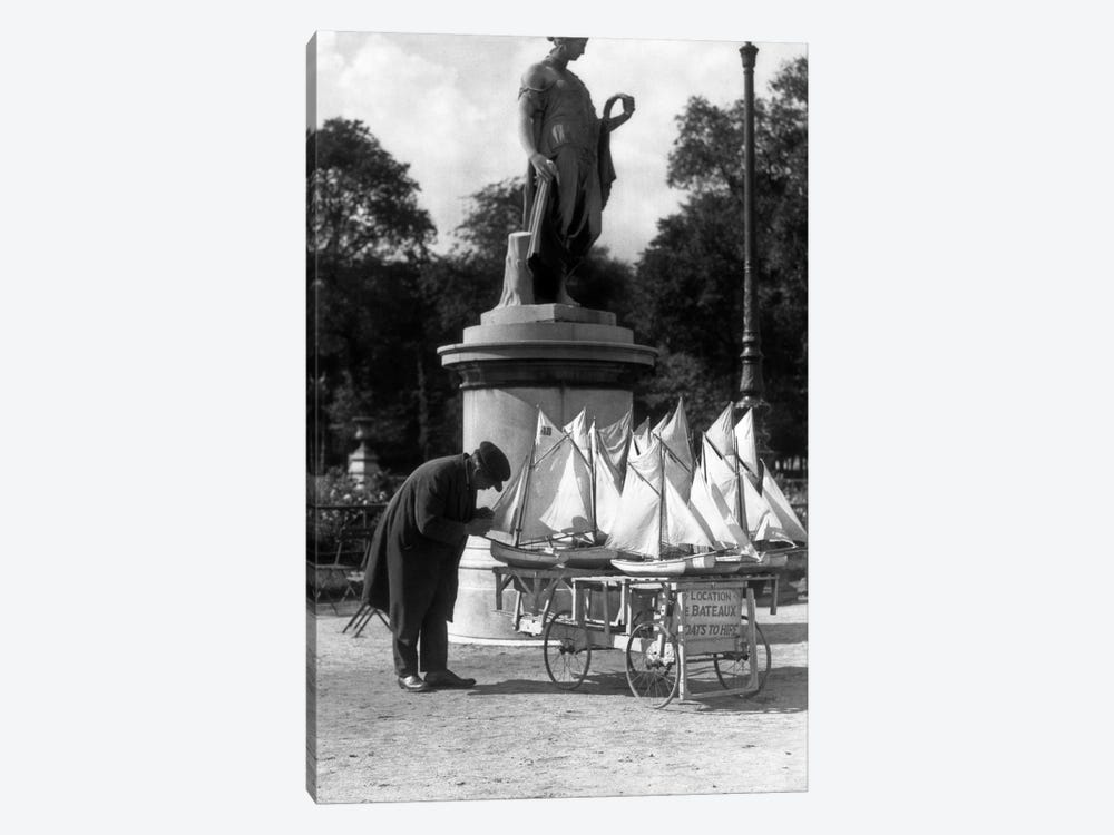 1930s Paris France Tuileries Gardens Man With Cart Of Miniature Toy Sailboats For Rent by Vintage Images 1-piece Art Print