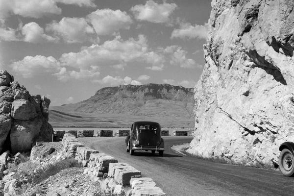 Wyoming: 1930s-1940s Car Driving On Mountain Road In Yellowstone National Park Near Cody Wyoming USA by Vintage Images