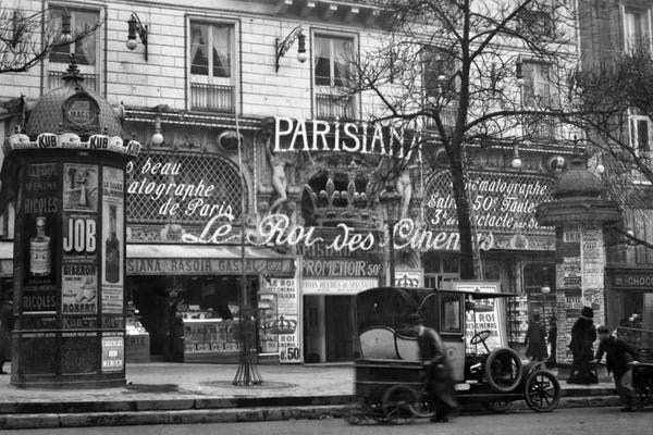 Paris Photography: 1910 Street Scene Showing A Kiosk And The Front Of The King Of Cinemas Theater Paris France by Vintage Images