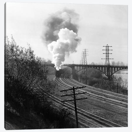1940s Aerial Of Train Traveling Along River Under Bridge Billowing Smoke Near Columbus Ohio Canvas Print #VTG198} by Vintage Images Canvas Art